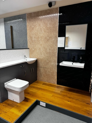 Bathroom Showroom showing sinks and toilet