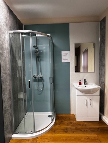 Bathroom Showroom showing curved shower unit and screen